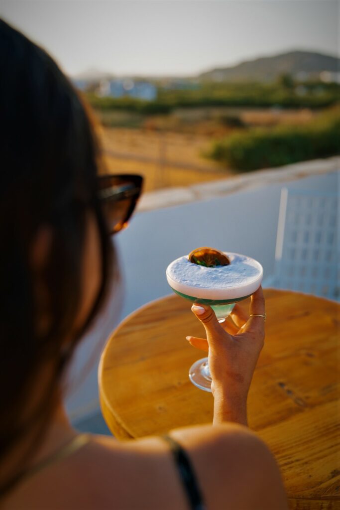 Girl costumer enjoy her cocktail at Rooftop Bar Naxos