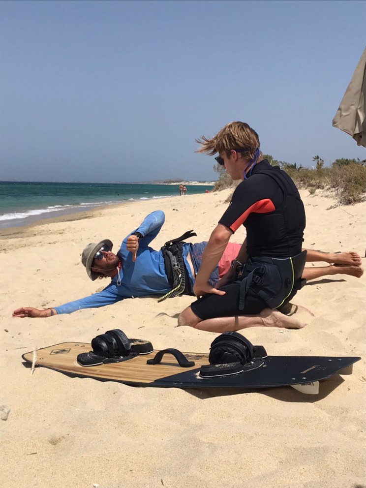 An instructor show to his student how to practice bodydrag upwind.