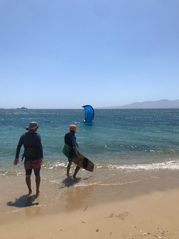 Students is getting ready to start his kitesurfing session in plaka beach ,naxos.